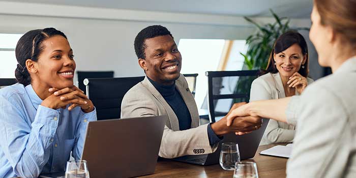 Student practicing interview questions with staff